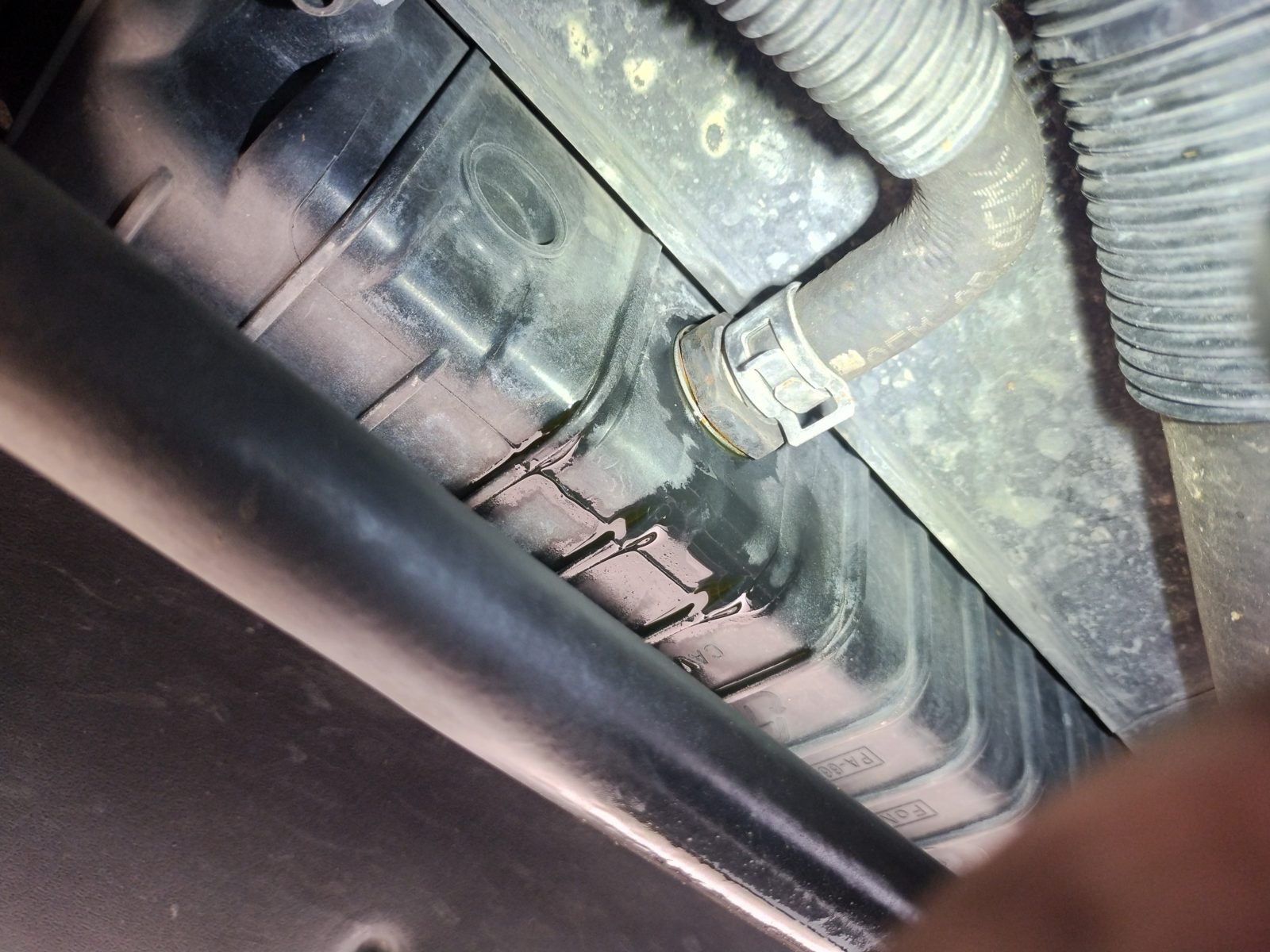 Mobile mechanic diagnosing an overheating engine in Austin